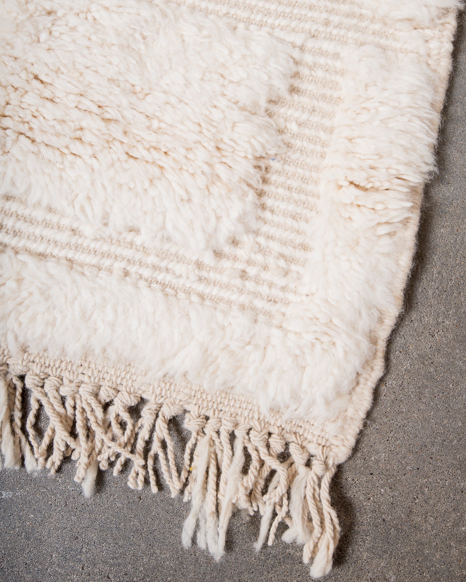 Modern, designer, handcrafted Berber rug from Morocco. Beniourain carpet with minimalist design, natural wool pile and a fluffy texture.